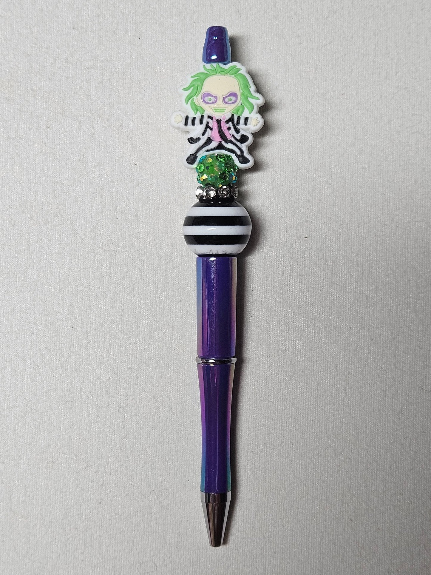 Beaded Beetlejuice purple iridescent plastic pen