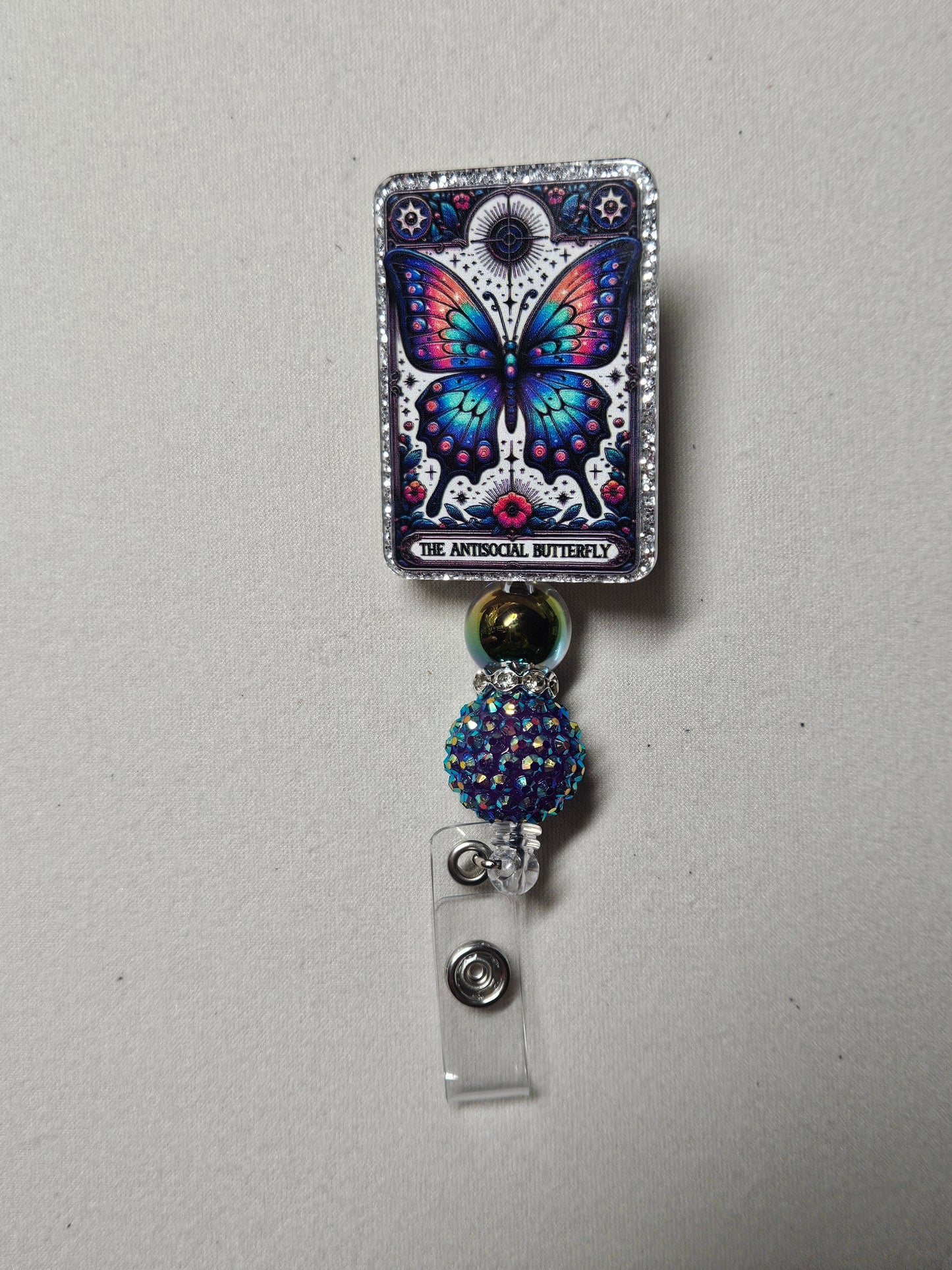 Antisocial butterfly badge reel