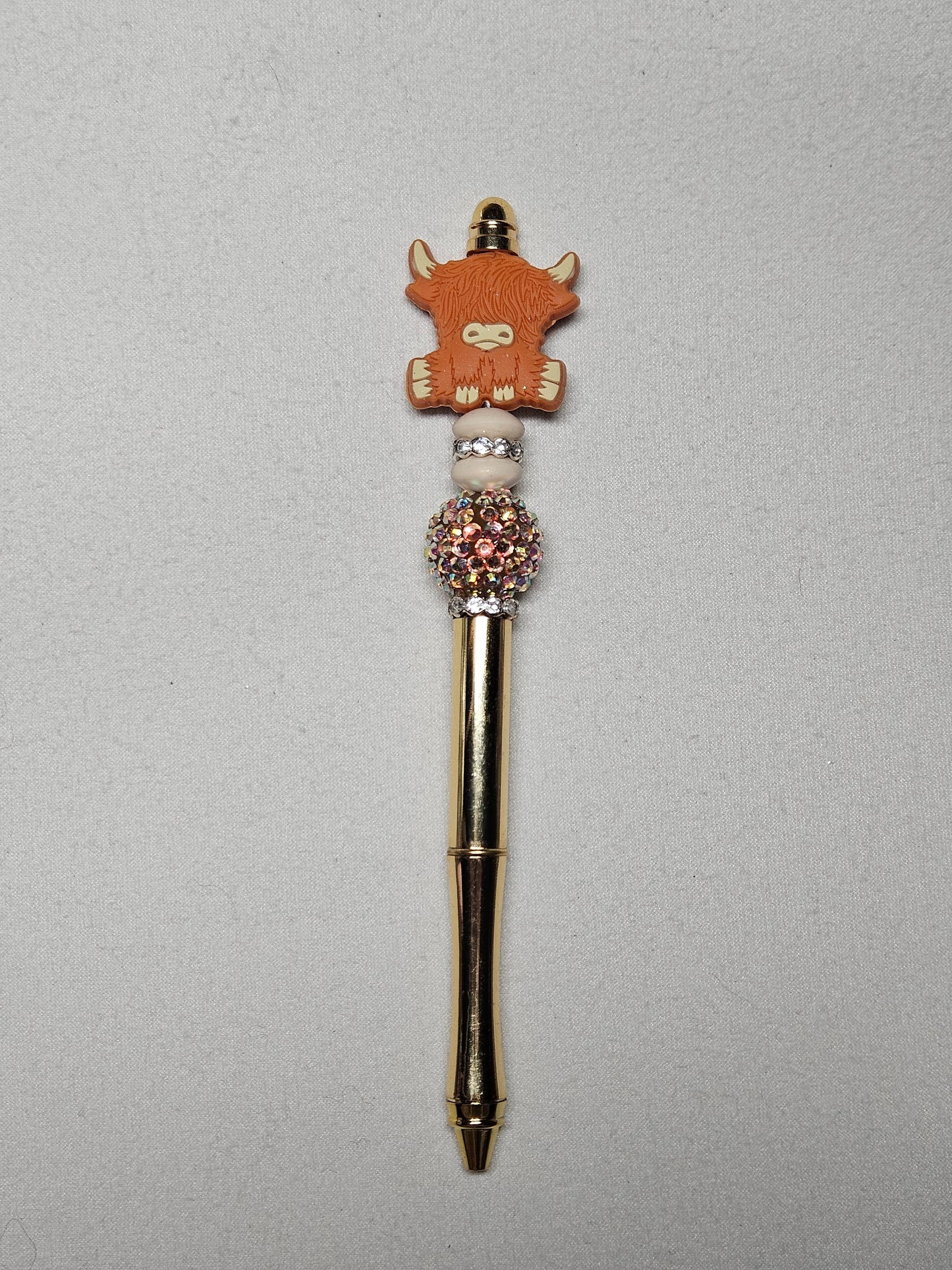 Beaded highland brown cow gold metal pen