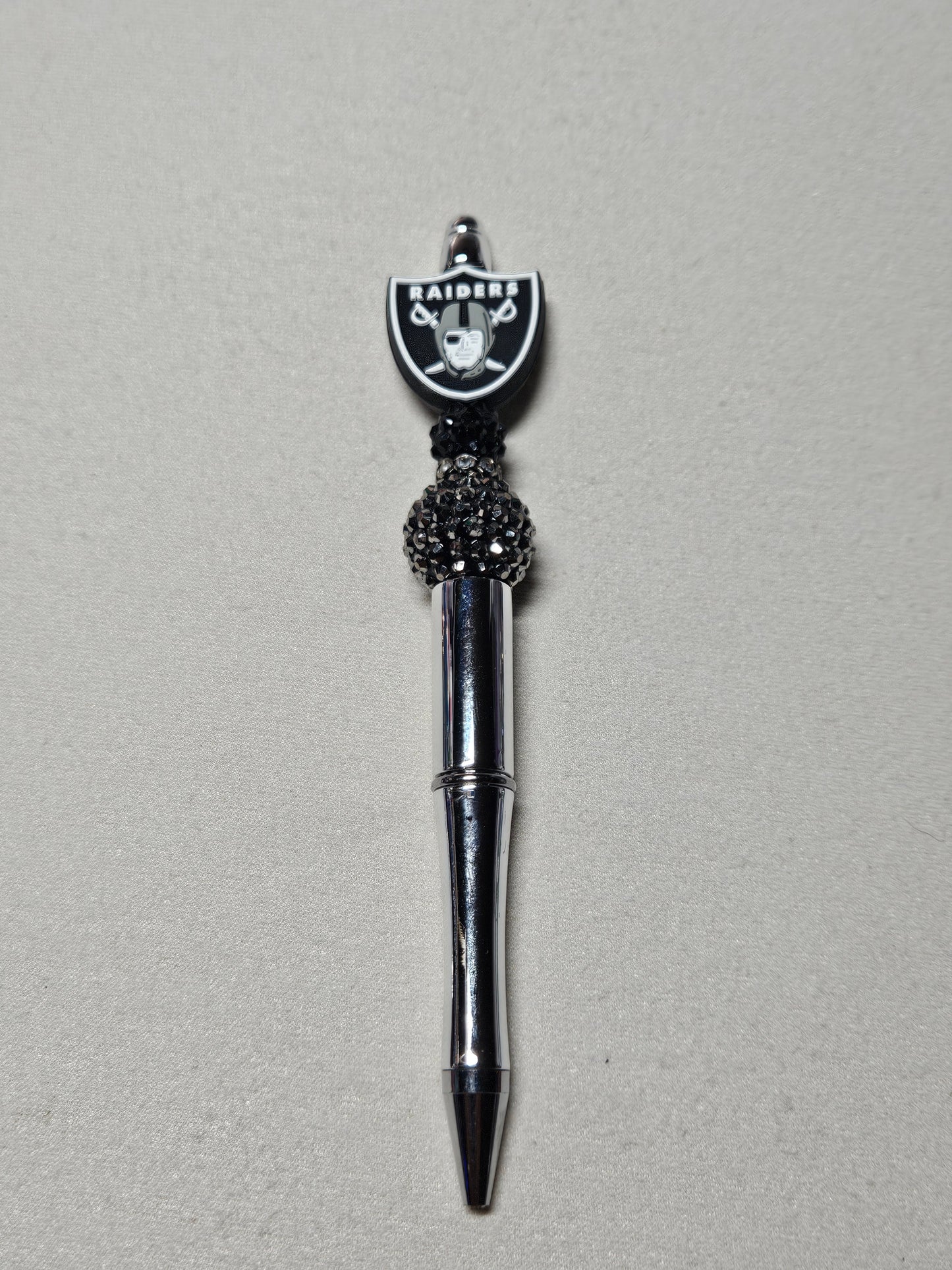 Beaded raiders silver plastic pen