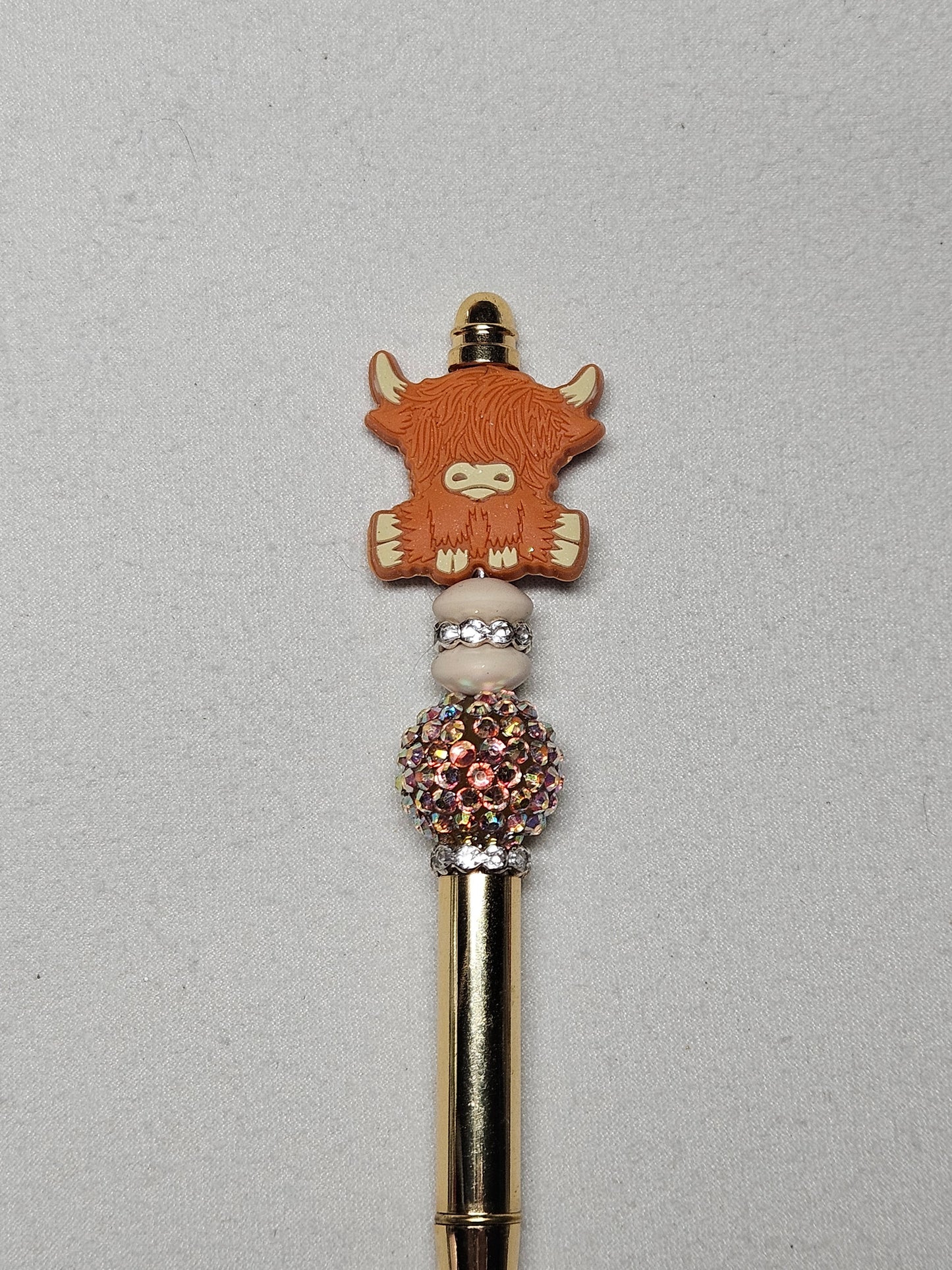 Beaded highland brown cow gold metal pen