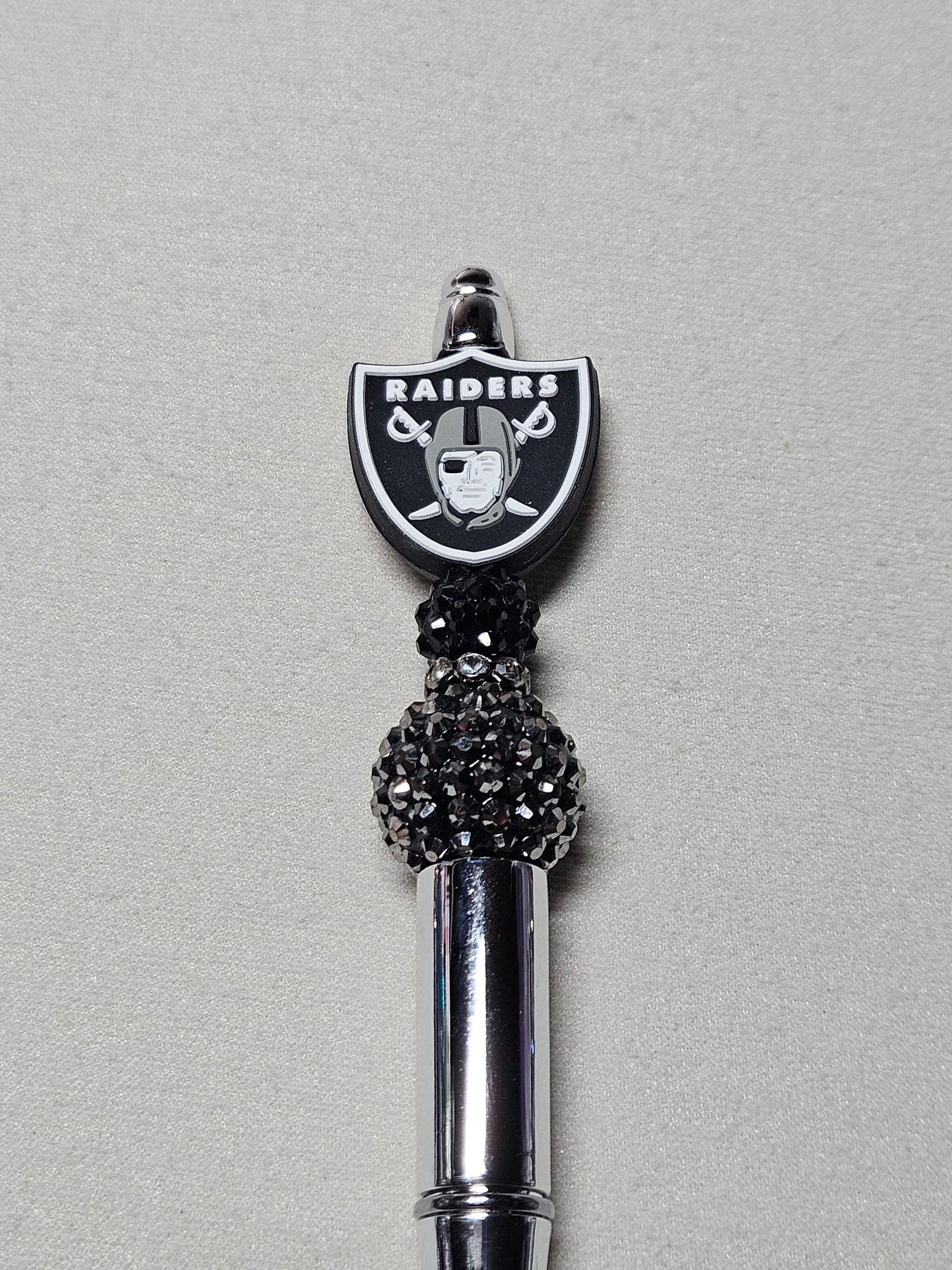 Beaded raiders silver plastic pen